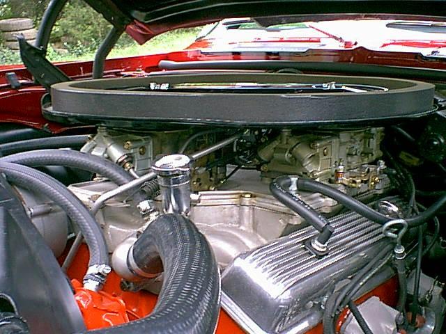The cross-ram intake manifold was developed for the 302 engine using knowle...